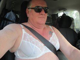 once again driving wearing just a bra