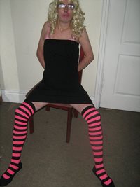 Debbie the slut with her arms handcuffed to the chair by her mistress Irene