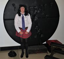 Schoolgirl Bettie after a good strapping. Wearing the Store 21 pantie girdl...