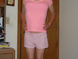 Dressed in pink shorts & a pink t-shirt. Underneath, I'm wearing a Victoria...