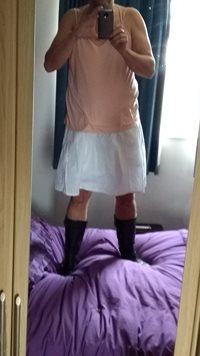 in my white skirt pink top n boots
