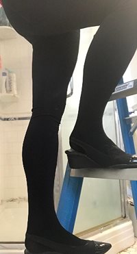 Climbing a ladder in new slingback and tights!