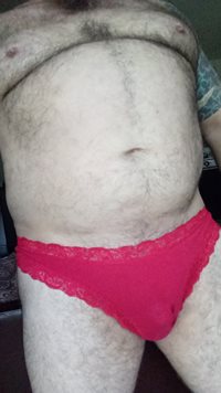 Starting to soak my lace trimmed red thong with pre cum