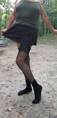 Wearing mini skirts panties and stockings makes my cock very stiff