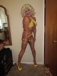 Bimbo blonde came bi and wanted to show me her little yellow swim suit.  Hm...