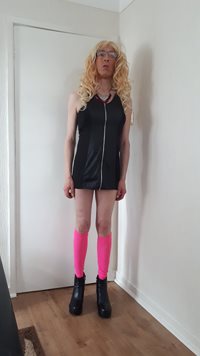 Debbie the slut in her new black leather dress makes her look very dominant