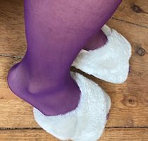 Purple nylons in fluffy slippers