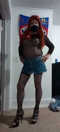 Redheaded sissy dressed  up looking to play
