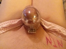 Trying to get hard in pink silk panties and my new EGG cage. Tight fit!!!!!