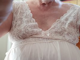 My breasts embraced by the gown.
