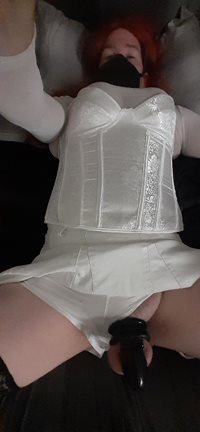 Sissy in her white outfit with her Chastity in device