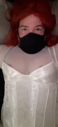 Sissy in her white outfit with her Chastity in device