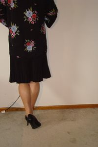Black Skirt and sheer tan hose and heels.