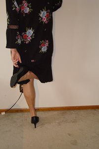 Black Skirt and sheer tan hose and heels.