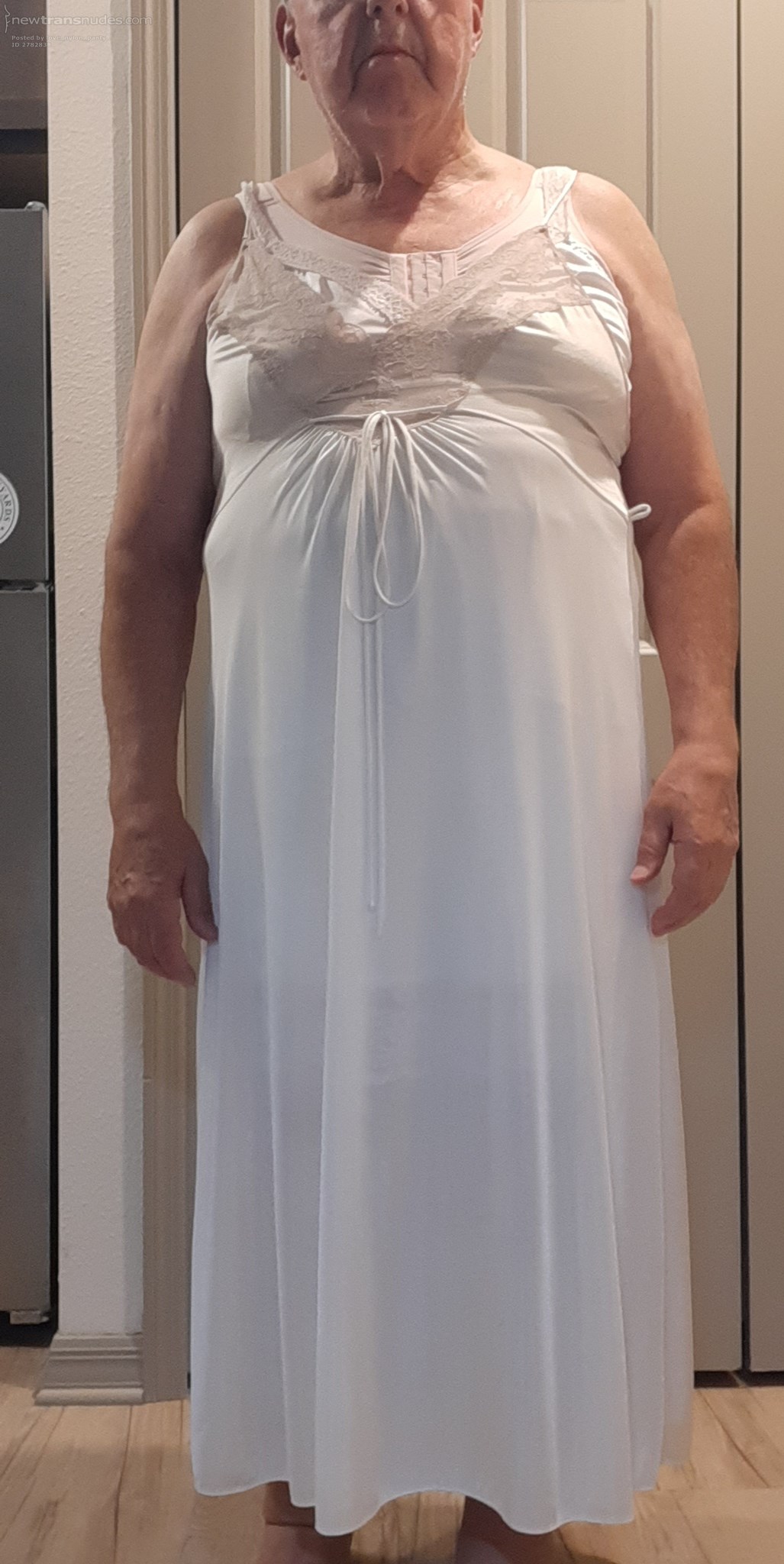 Fully dressed in nylon lingerie.