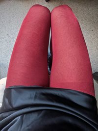 Black satin dress and red tights