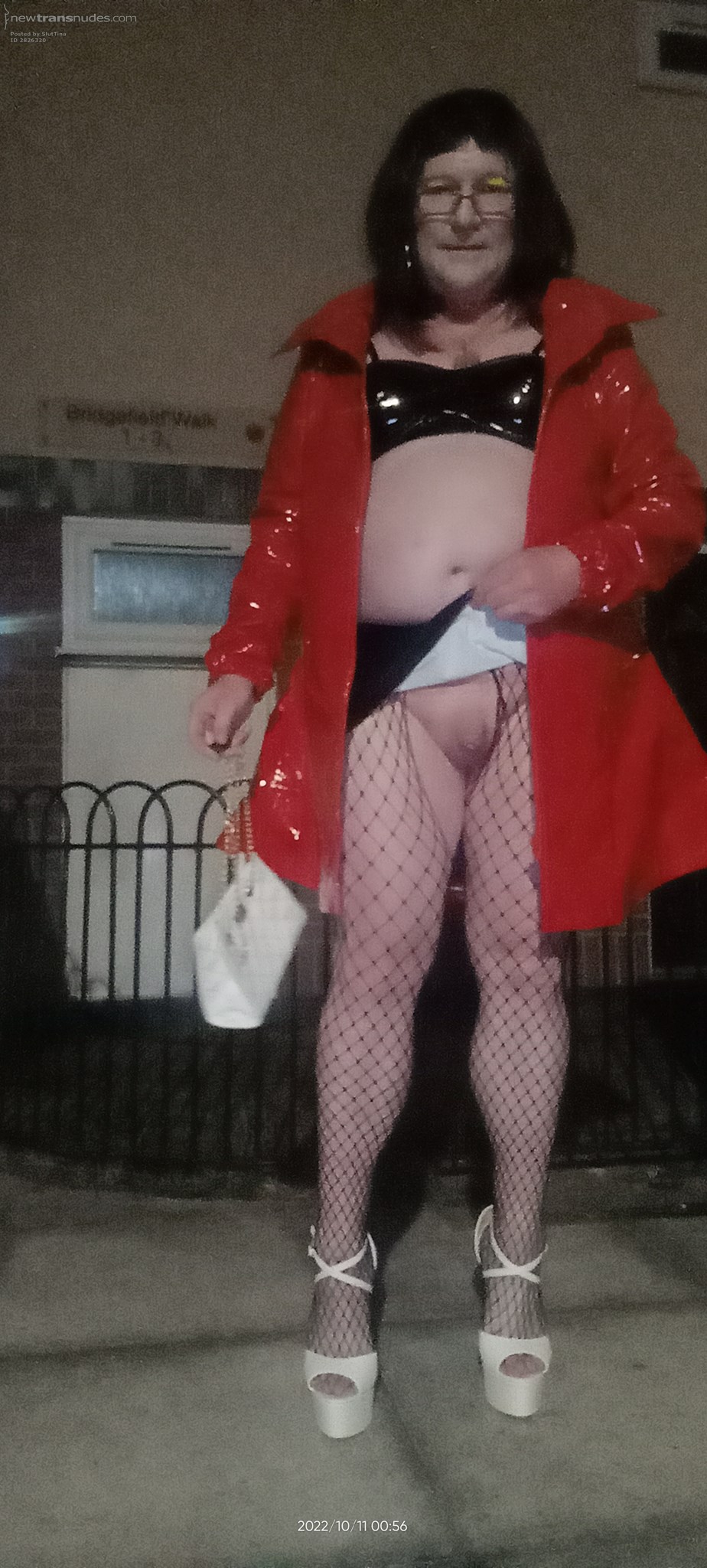 Red PVC acting the hooker