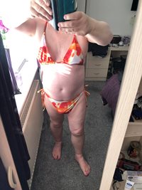 trying on Bikini's for my beach trip.  Do you like the Pink, the Orange or ...