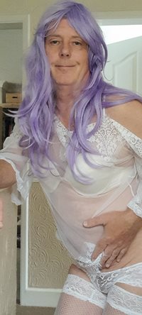 Sissy, dressed, wig but no make up. What you see is what you get.