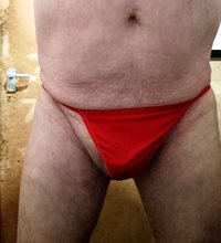 Wearing a red G-string