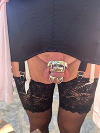 Black girdle over cream Basque and chastity cage
