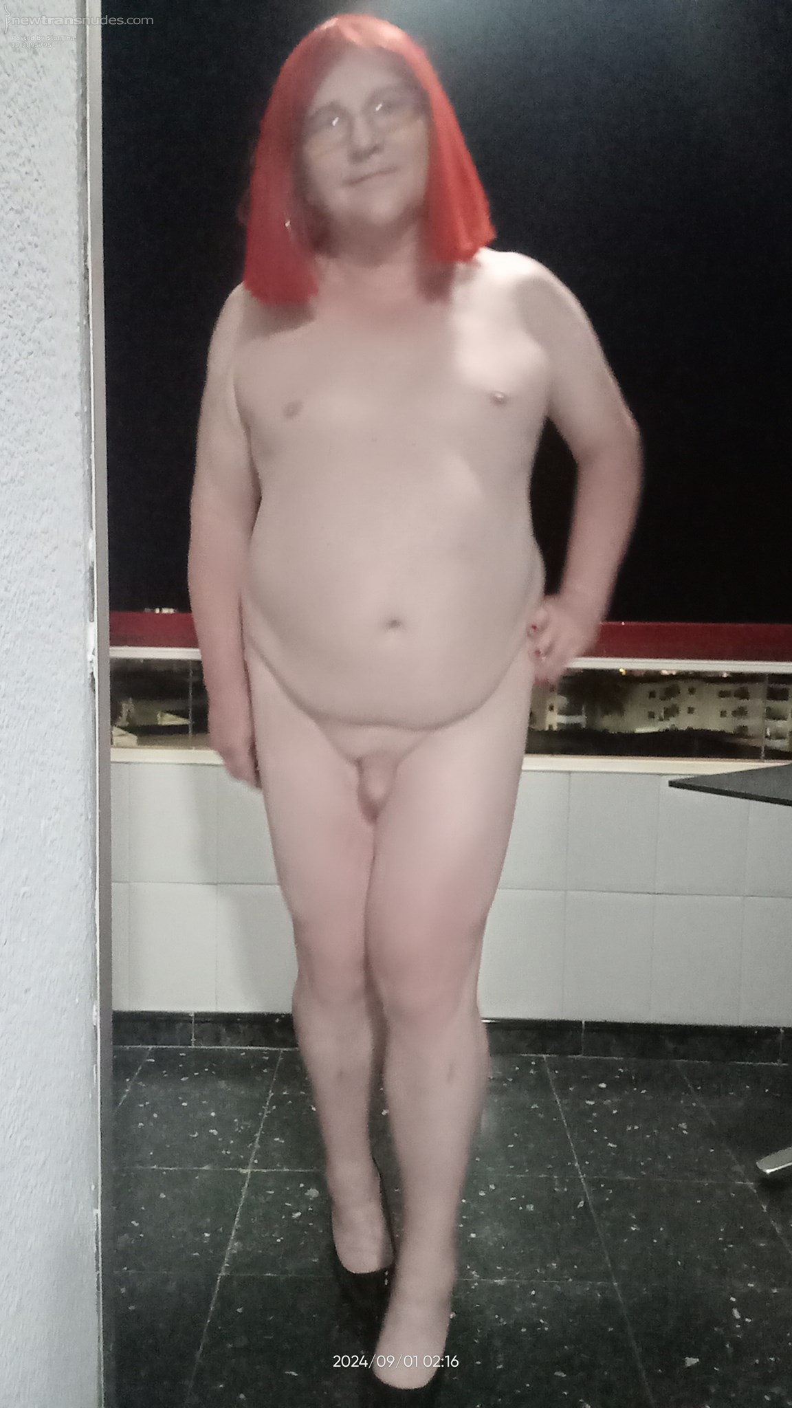 ME nude on a balcony