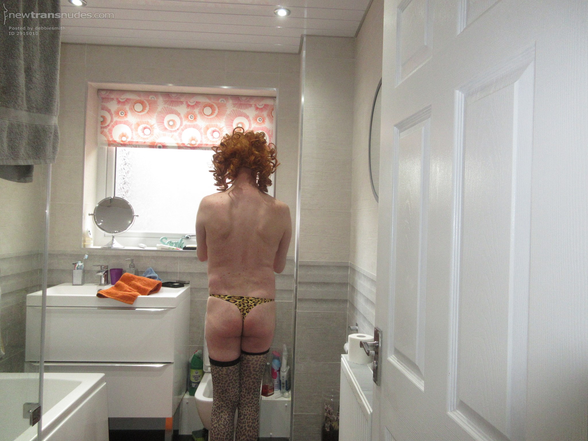 Debbie the slut posing in her leopard print thong in her remodeled bathroom