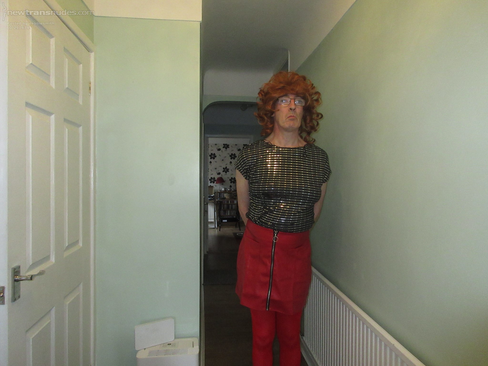 Debbie the slut posing in her new red leather skirt