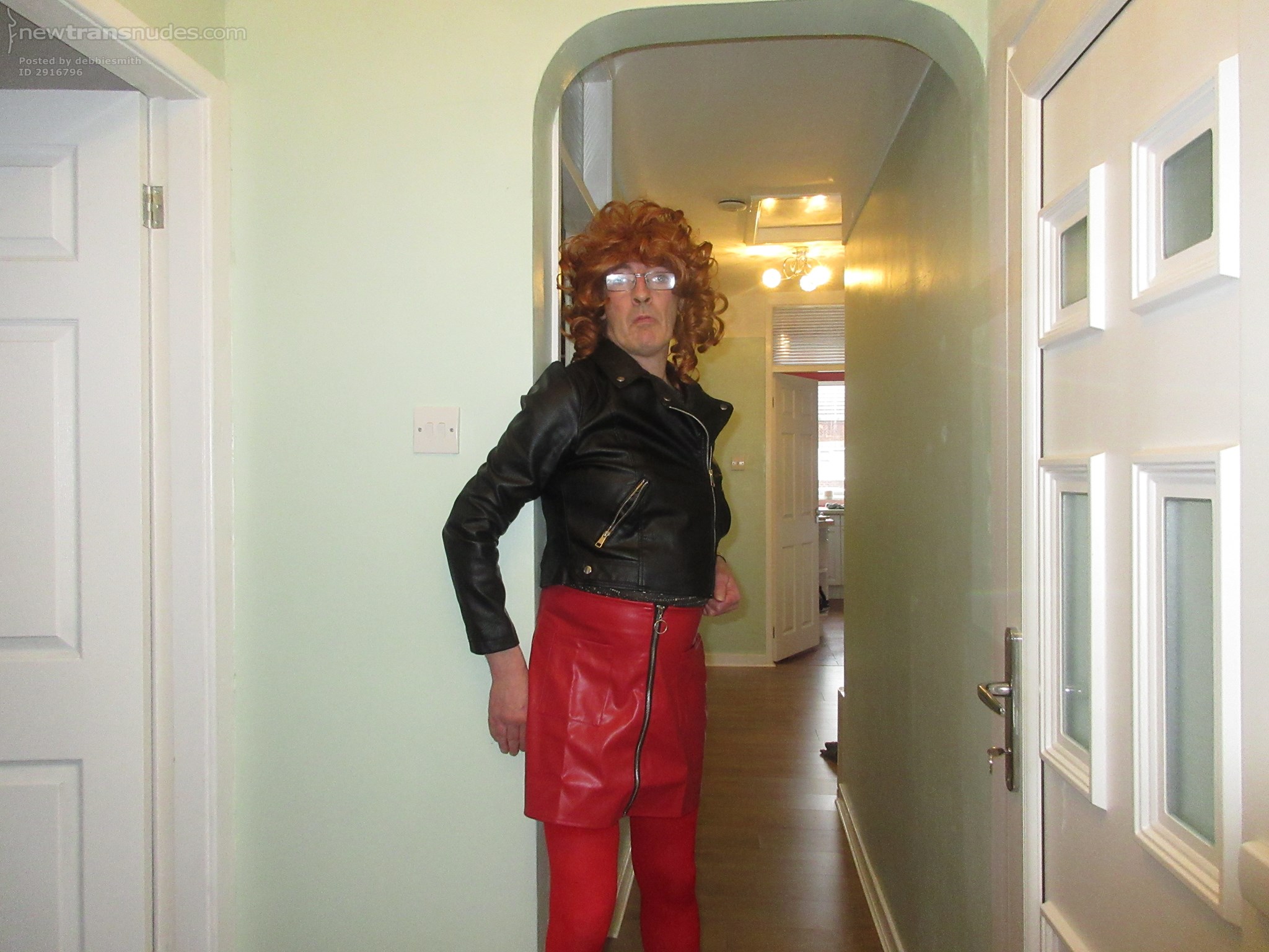Debbie the slut posing in her new red leather skirt