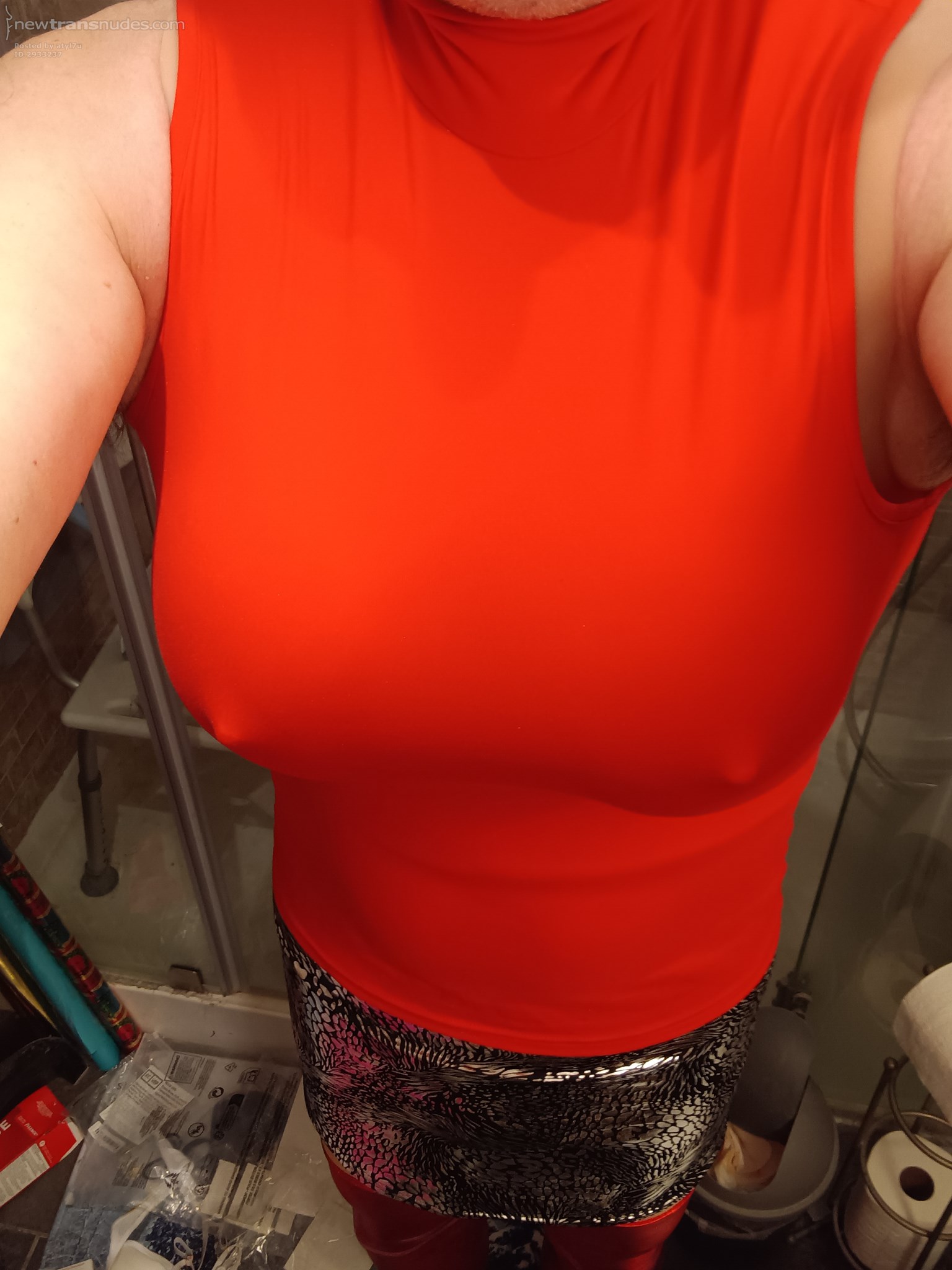 red top and silver leopard skirt