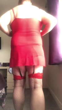 My favourite colours  red and black stockings.  Red heels with  close up cu...
