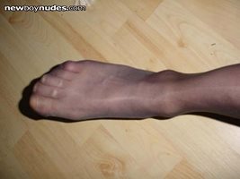 anyone want me to rub my nylon clad feet on their cock