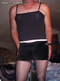 my black mini skirt with a nice tight black top that make my tities show mo...