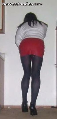 ass in a tight latex mini skirt