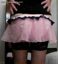 Pink skirt and panties.  Rear view.