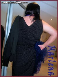 This dress is quiet sexy its dark blue with little white pok a dots its tea...