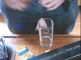 pissing in a glas