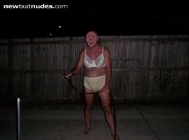hoseing the garden in the front yard in my bra and panties