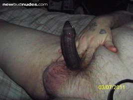 My hard cock with a black condom on