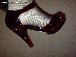 Sexy shoes and fishnet stockings.  