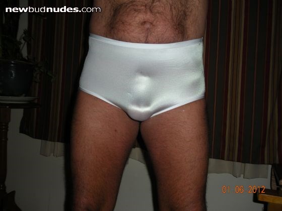 new panty number 2 - classic white stretchy nylon briefs - the bulge is a 2 inch ball stretcher that i lock on when the birdlock is off - please vote -