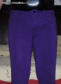 Shiny black bodysuit and stretchy purple pants