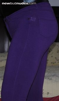 Shiny black bodysuit and painted on purple pants