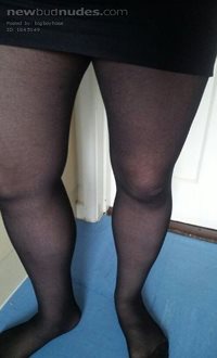 Black tights and black mini skirt
