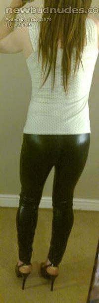 Lucy in white top, black wet look leggings and heels!!!