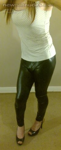 Lucy in white top, black wet look leggings and heels!!!