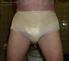 Gold panties over my bulging wet diapers. Let me know what you think.