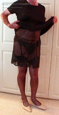 Wearing a very comfortable mini dress with hem lifted to show my undies.