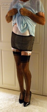 Wearing a white open bottom girdle to hold up my nylons - a constant turn o...