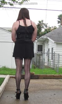 Naughty sexy slut in her outfit taken pics outside in backyard